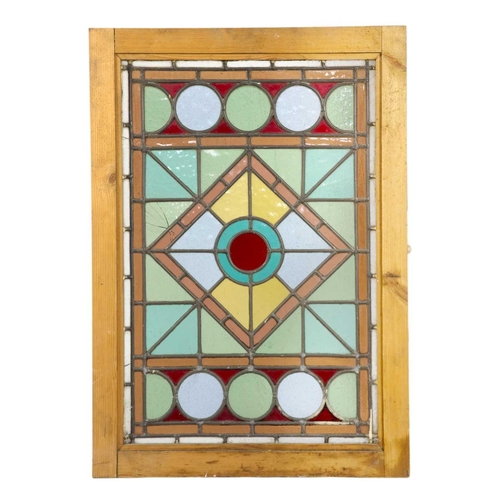 25 - A stained glass lead lined panel. In a pine frame, 74 x 52.3cm.