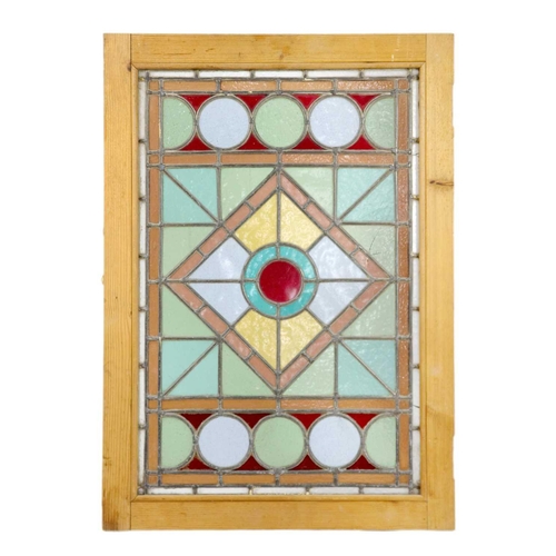 25 - A stained glass lead lined panel. In a pine frame, 74 x 52.3cm.