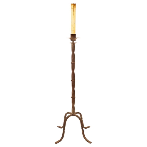 251 - A wrought iron candle stand, 20th century. With a twisted square section column, on four feet, heigh... 