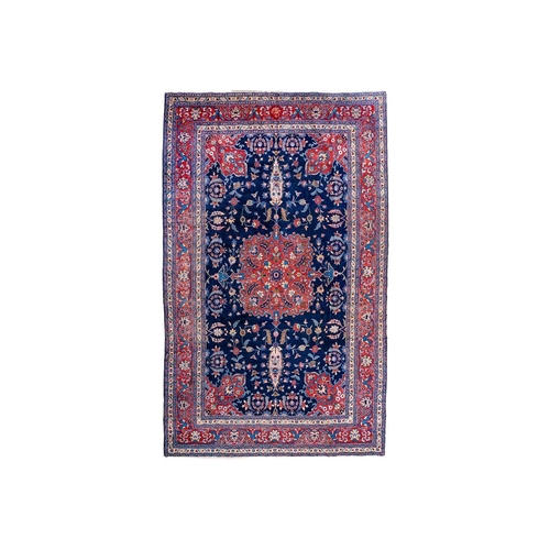 257 - A Tabriz carpet, North West Persia, circa 1920. With signature cartouche, the indigo field with a ce... 