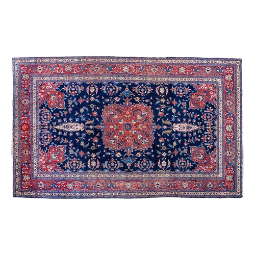 257 - A Tabriz carpet, North West Persia, circa 1920. With signature cartouche, the indigo field with a ce... 