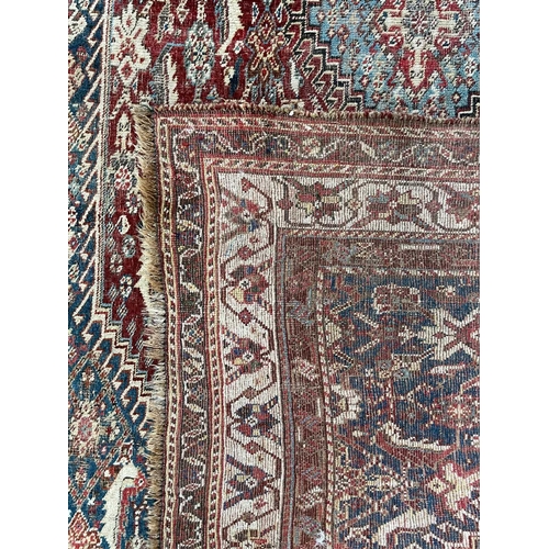 260 - A Ghashgai rug, South West Persia, circa 1900. The madder field with a triple linked medallion, leav... 