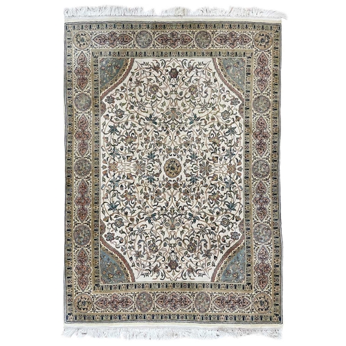 263 - A Persian carpet. The ivory field with large scrolling vines and leaves, 248 x 193cm.