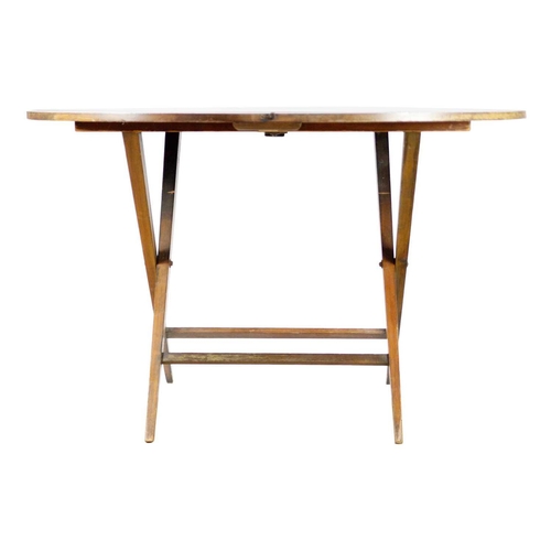 287 - A mahogany folding campaign table, early 20th century. The circular top on square tapering legs, wit... 