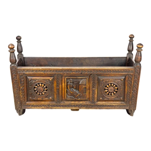 292 - A 19th century oak cradle. Height 61cm, width 100cm, depth 44cm.