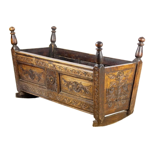 292 - A 19th century oak cradle. Height 61cm, width 100cm, depth 44cm.