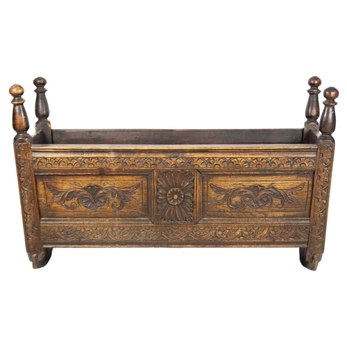 292 - A 19th century oak cradle. Height 61cm, width 100cm, depth 44cm.