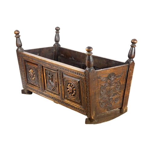 292 - A 19th century oak cradle. Height 61cm, width 100cm, depth 44cm.