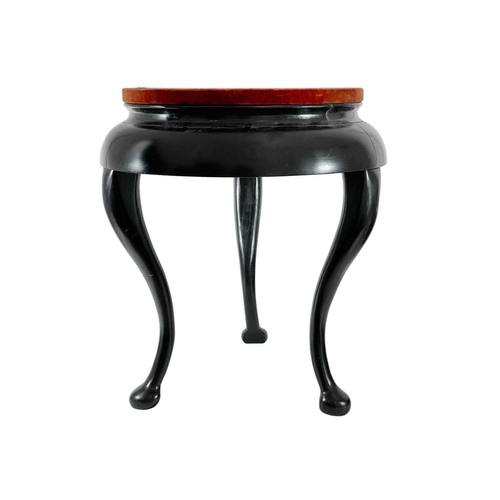 307 - An ebonised display stand, 20th century. With three cabriole legs, height 55cm, diameter of red velv... 