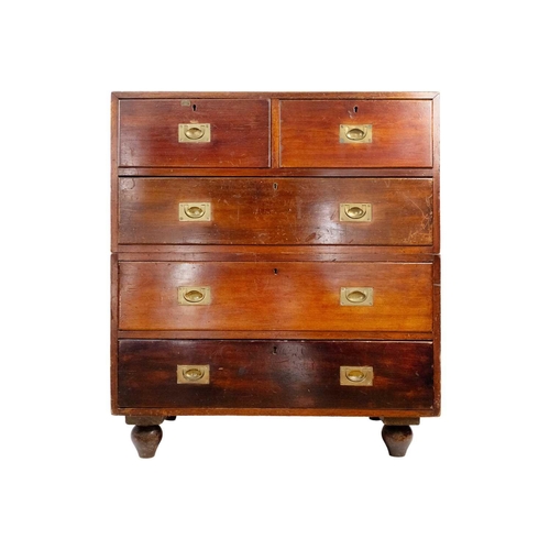 308 - A Victorian mahogany campaign chest. With two short and three long drawers, on bun feet, height 105c... 