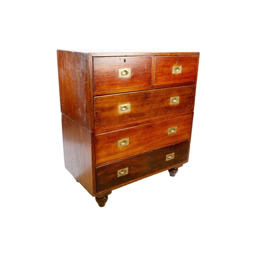 308 - A Victorian mahogany campaign chest. With two short and three long drawers, on bun feet, height 105c... 