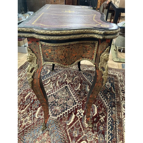 309 - A French Boulle fold over serpentine card table, 19th century. In the Louis XV style, with leather i... 