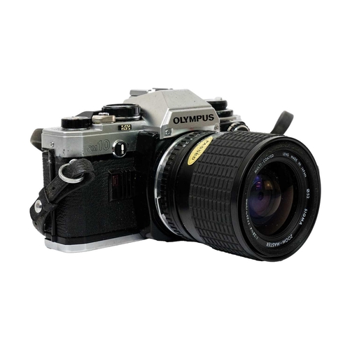 32 - An Olympus OM10 SLR camera. Fitted with a Sigma Zoom Master 35-70mm lens and other accessories toget... 