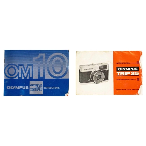 32 - An Olympus OM10 SLR camera. Fitted with a Sigma Zoom Master 35-70mm lens and other accessories toget... 