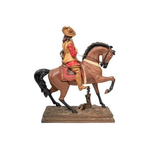 38 - A painted spelter figure of a Cavalier on horseback. On a rectangular base, height 48cm.