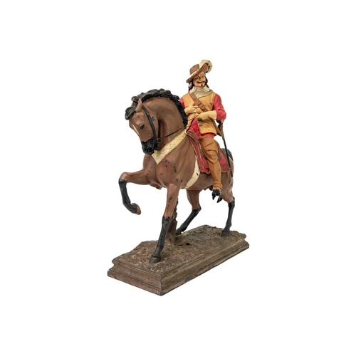 38 - A painted spelter figure of a Cavalier on horseback. On a rectangular base, height 48cm.