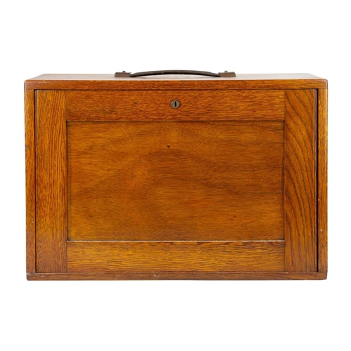 62 - An oak stationary cabinet, early-mid 20th century. The interior with five drawers, height 32cm, widt... 