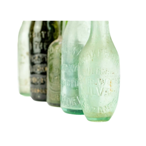 63 - A glass mineral water bottle E. Wakeham Mineral Water Works Gulval Penzance. Height 18cm, together w... 