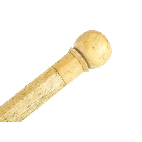 64 - A 19th century sailor's whalebone and marine ivory walking cane. Length 90.5cm.