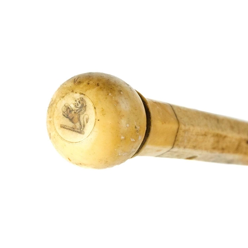 64 - A 19th century sailor's whalebone and marine ivory walking cane. Length 90.5cm.