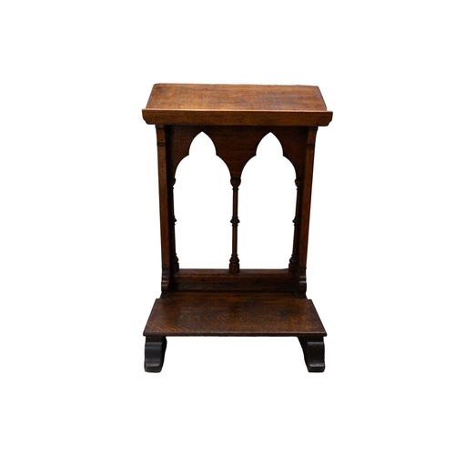 65 - A Victorian Gothic oak lectern. Carved with flowers and foliage, and with turned column pilasters. H... 