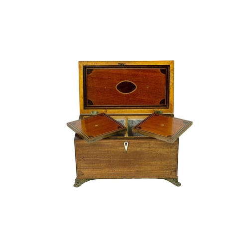 68 - A George III mahogany, inlaid, and crossbanded tea caddy. Fitted two lidded compartments, on stamped... 