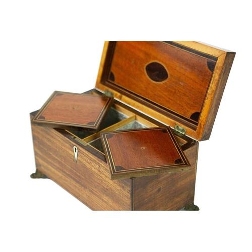 68 - A George III mahogany, inlaid, and crossbanded tea caddy. Fitted two lidded compartments, on stamped... 