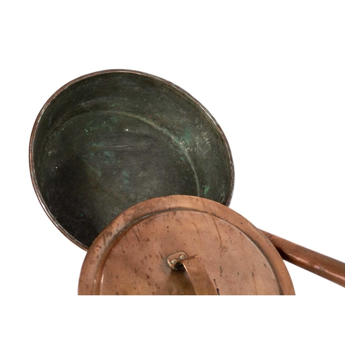 73 - A large 19th century copper bed pan. Length 167cm.