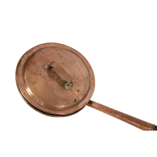 73 - A large 19th century copper bed pan. Length 167cm.