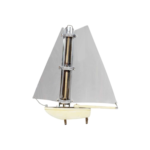 74 - An electric fire in the form of a sailing boat. Height 75cm, width 65cm.