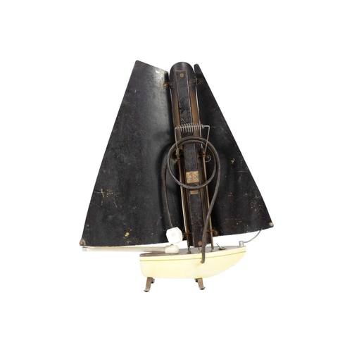 74 - An electric fire in the form of a sailing boat. Height 75cm, width 65cm.