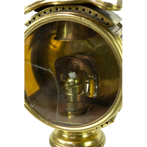 78 - A brass nautical candle lamp With White Star Line plaque, length 53.5cm.