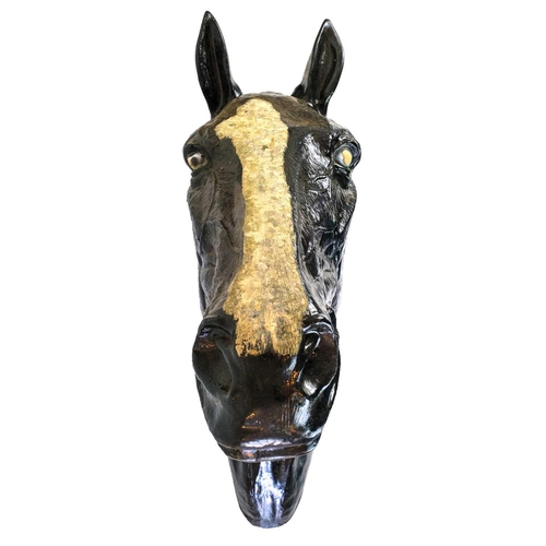 79 - A life sized fibre glass model of a horses head. Height 75cm, width 24cm, depth 55cm.