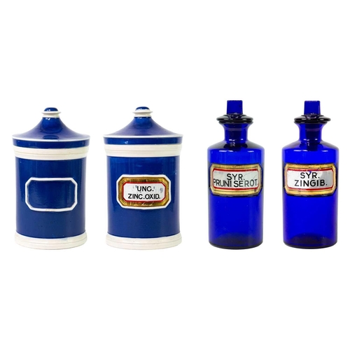 80 - Two blue glass apothecary bottles and stoppers Height 20cm, together with two ceramic apothecary jar... 