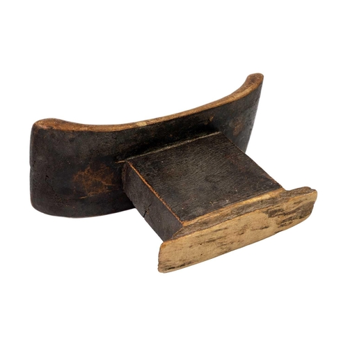 90 - A Zimbabwean Tonga headrest Early 20th century, with a curved top, and rectangular support, height 1... 