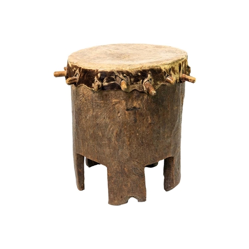 96 - A Zimbabwean 'Ngoma' drum With pegged taut hide, and hollowed cylindrical body with a shaped base, h... 