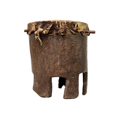 96 - A Zimbabwean 'Ngoma' drum With pegged taut hide, and hollowed cylindrical body with a shaped base, h... 