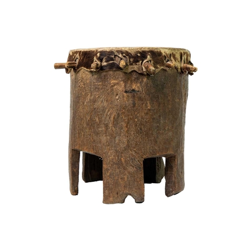 96 - A Zimbabwean 'Ngoma' drum With pegged taut hide, and hollowed cylindrical body with a shaped base, h... 