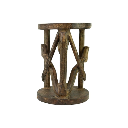 98 - A Bamileke wood carved figural stool. Height 40.5cm.