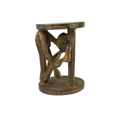 98 - A Bamileke wood carved figural stool. Height 40.5cm.