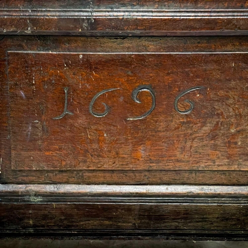 1056 - A late 17th century oak coffer. The two panel front initialled EIF and dated 1696, height 62cm, widt... 