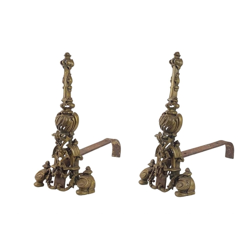 1 - A pair of French brass chenets. In Louis XVI style, height 50cm.