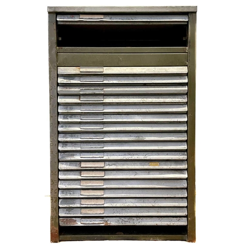 112 - An 18 drawer painted steel printer's block cabinet, with some type. Height 110cm, width 68cm, depth ... 