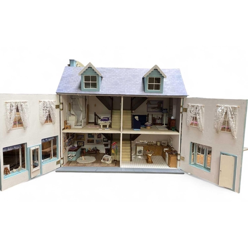 114 - A large dollhouse Gwenver Gallery. Fully furnished with an art gallery, kitchen, living room, bedroo... 