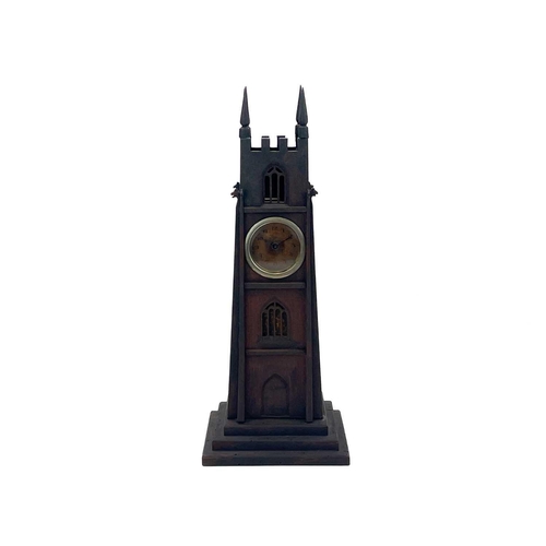 141 - An early 20th century pocket watch stand. Modelled as a gothic revival tower, height 36cm.