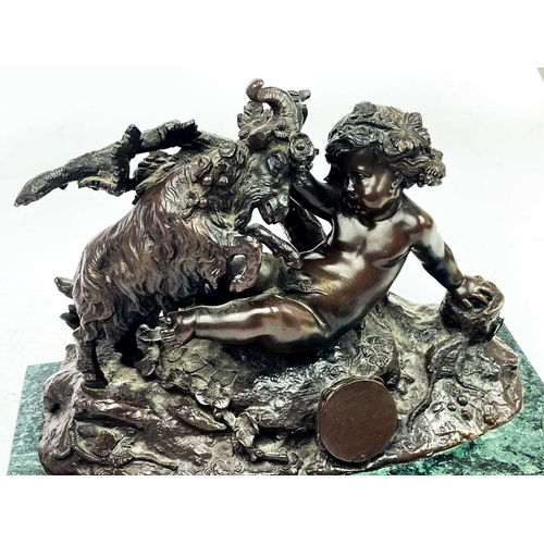 156 - After Clodion, a patinated bronze putti and ram group. 20th century, on a green marble base, height ... 