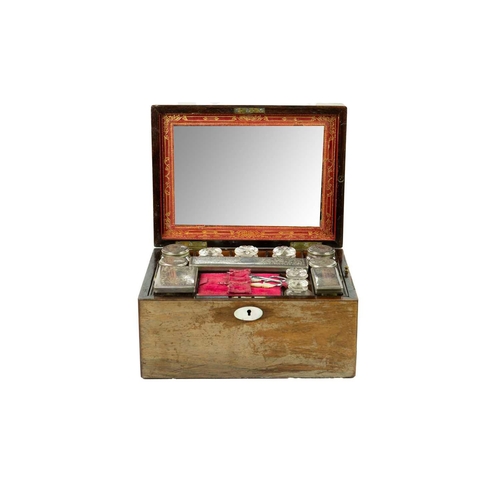 168 - A Victorian rosewood fitted vanity box. The lid with a mirror, the tray with glass jars, some with p... 