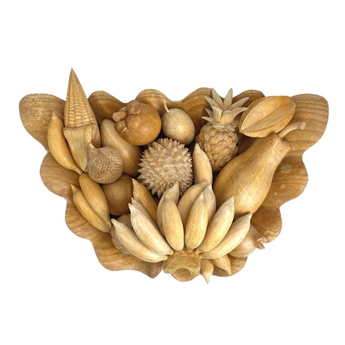 174 - A treen carved shell shaped fruit bowl and various fruits. Width 52cm.