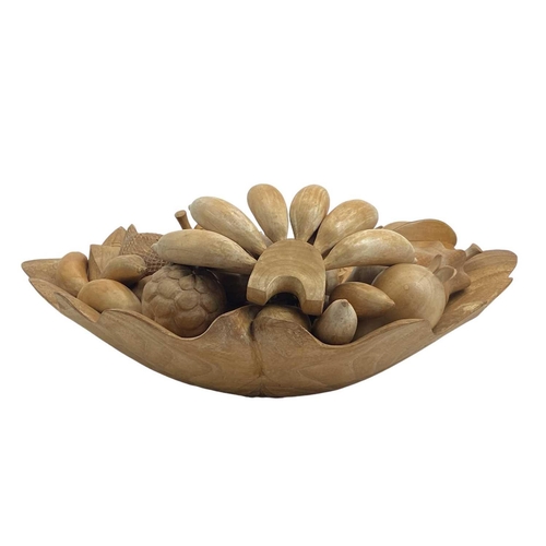 174 - A treen carved shell shaped fruit bowl and various fruits. Width 52cm.