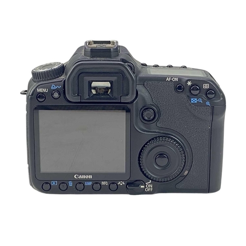 179 - A Canon EOS 40D camera body. Fitted with a Compact-Macro 50mm lens, together with a Canon D60 camera... 